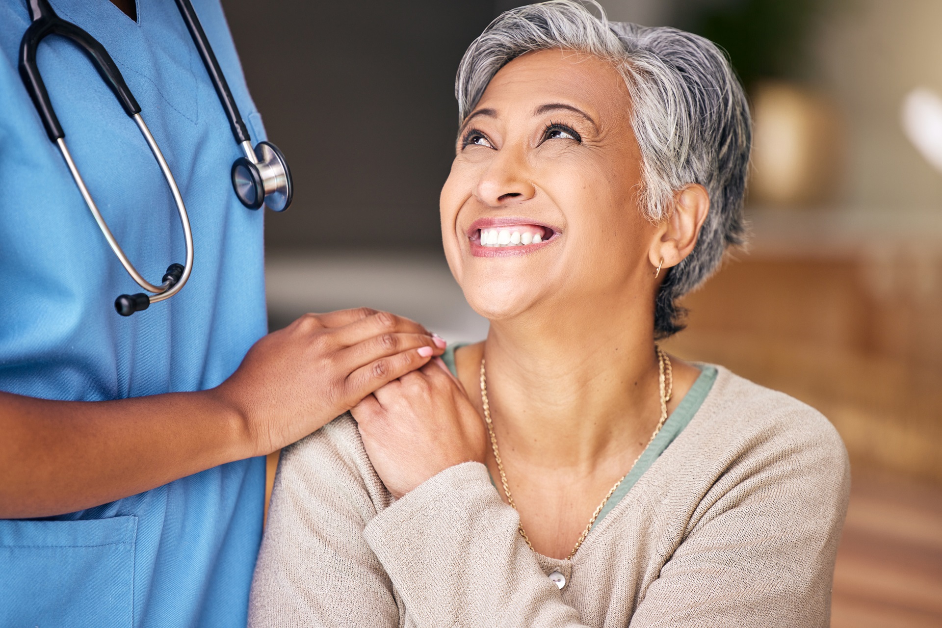 Older Asian woman with medical professional